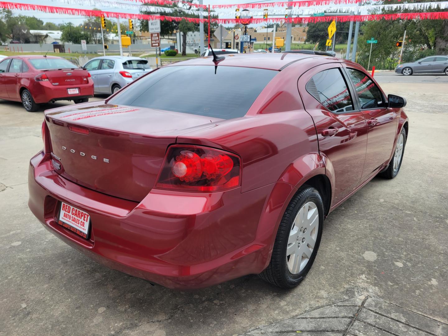 2014 Red Dodge Avenger SE (1C3CDZAB1EN) with an 2.4L L4 DOHC 16V engine, 4-Speed Automatic transmission, located at 503 West Court, Seguin, TX, 78155, (830) 379-3373, 29.568621, -97.969803 - 2014 Dodge Avenger SE with a 2.4L L4 DOHC 16V, Automatic, Tilt, Cruise, AM/FM/CD/AUX Stereo, Power Windows, Locks and Side Mirrors, Tinted Windows, Rear Defroster and more!! - Photo#2